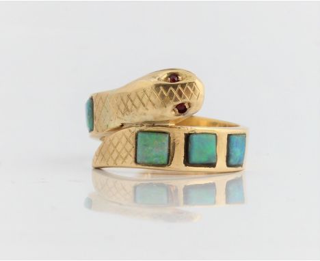 A hallmarked 18ct yellow gold opal snake design ring with red stone eyes, ring size M, approx. weight 10.5g. IMPORTANT: Onlin