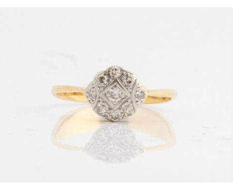 A diamond cluster ring, stamped 18ct, ring size M½. IMPORTANT: Online viewing and bidding only. No in person collections, an 