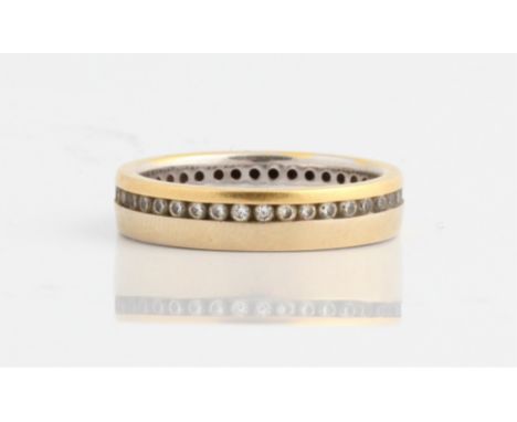 A hallmarked 18ct yellow and white gold diamond full eternity ring, set with round brilliant cut diamonds, ring size N, appro