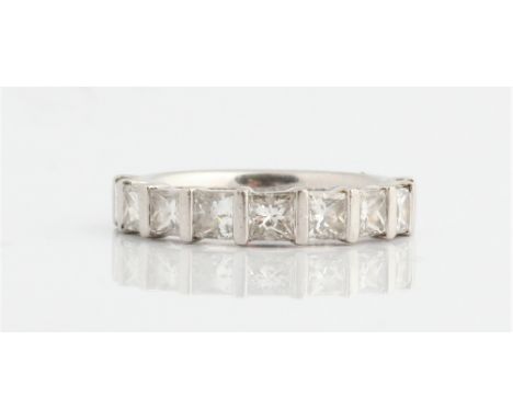 A diamond nine stone half eternity ring, bar set with nine princess cut diamonds, total diamond weight approx. 1.80ct, stampe