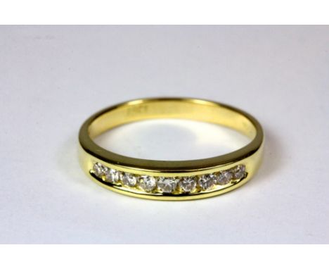 A 9ct yellow gold and diamond half eternity ring (M.5)