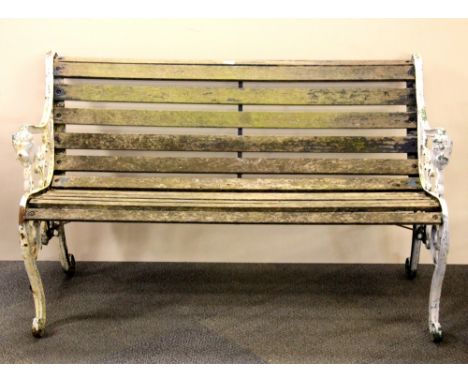 A cast iron and wood garden bench + 2 additional bench supports