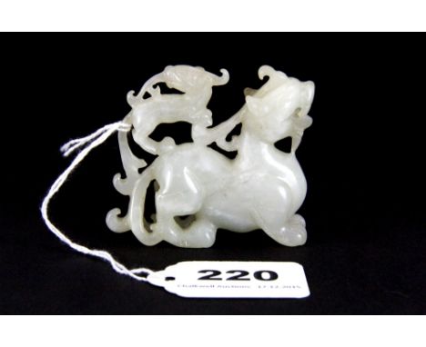 A 19th century Chinese carved mutton fat jade figure of a dragon with a young dragon on his back, W. 6.5cm H. 6cm