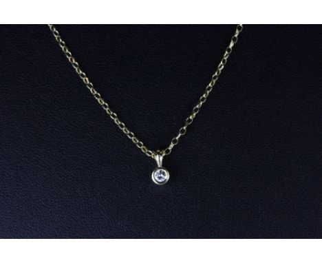 An 18ct yellow gold rub over set diamond pendant and 18ct gold chain