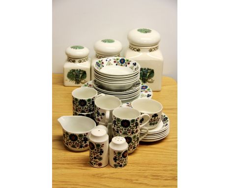 An extensive Midwinter dinner and tea set together with 3 Taunton Vale storage jars.