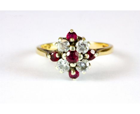 A 9ct gold ring set with 4 good diamonds and rubies (K)