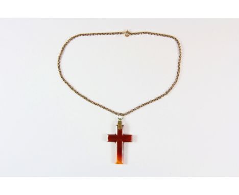 A Victorian carved agate cross and gold plated chain. Cross L. 4.5cm chain L. 36cm.