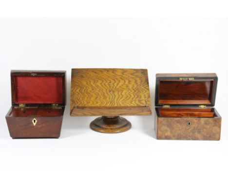A burr walnut stationery box, a Victorian mahogany tea caddy and an oak book stand.
