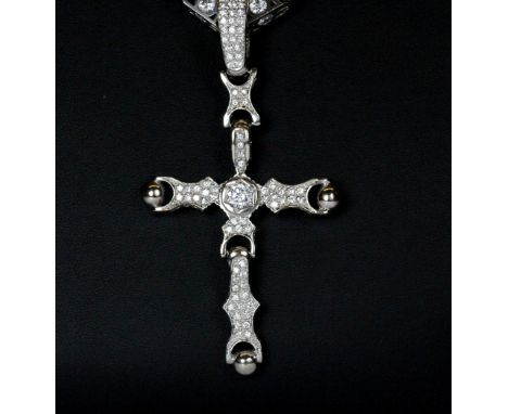 An incredible 9ct white gold stone set cross and 10ct white gold stoneset chain (Cross height 11cm), (Chain length 74cm)