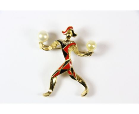 A Christian Dior gilt and enamel pierot brooch with box.