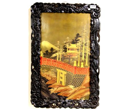 A 19thC Japanese lacquered panel in a carved wooden framed (46cm x 70cm)