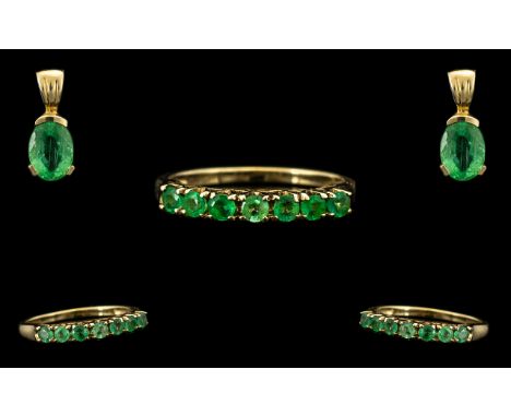 9 ct Yellow Gold Siberian Emerald 7 Stone Eternity Ring - Stone weight 0.387 cts. Together with a matching single stone penda