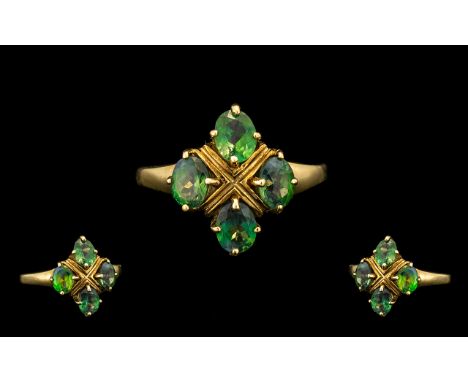 A Ladies 9ct Gold Russian Alexandrine Attractive Set Cluster Ring. The Four Oval Mixed Cut Medium Green Gemstones with Modera