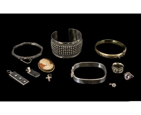 A Small Collection of Silver Jewellery to include two silver hinged bangles, a fully hallmarked silver gilt bangle with engra