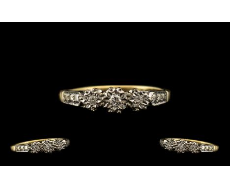 18ct Gold Three Stone Diamond Ring set with three round brilliant cut diamonds - illusion set. Stamped 18ct. Ring size J