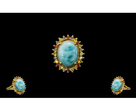 Larimar and Green, Yellow and Sunset Sapphire Ring, a 10ct cabochon of the natural, opaque, beautifully mottled sky blue lari