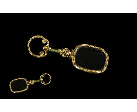 A Victorain Yellow Metal &amp; Enamel Gentleman's Eye Glass. With scroll loop finial and enamelled handle. With a scroll fram