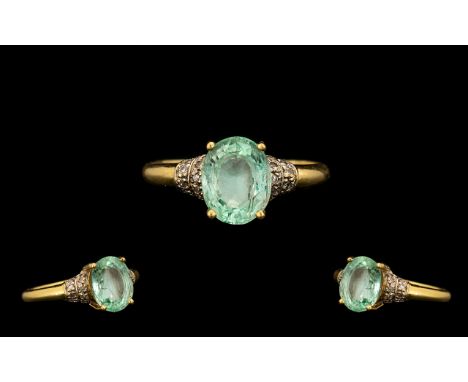 18ct Gold - Nice Quality Paraiba Tourmaline and Diamond Set Ring. The oval shaped paraiba tourmaline of pale green colour. Me