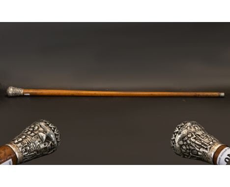 A North American Walking Stick with a possibly Silver Engraved Top, looks silver.  Handle of large proportions.  Please see i