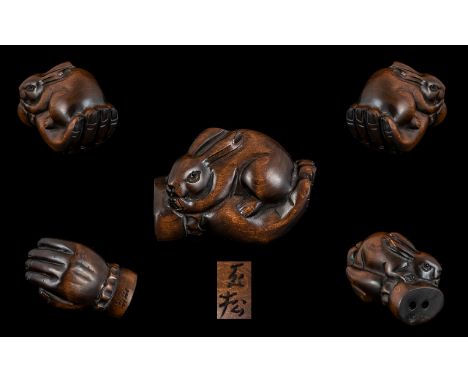 Japanese Nice Quality and Signed Carved Boxwood Netsuke, In The Form of a Large Hand Holding a Small Rabbit to Palm. Signed t