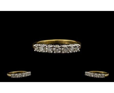 18ct Gold Attractive Seven Stone Diamond Set Dress Ring of Excellent Design. Full hallmark for 18ct. The seven round brillian