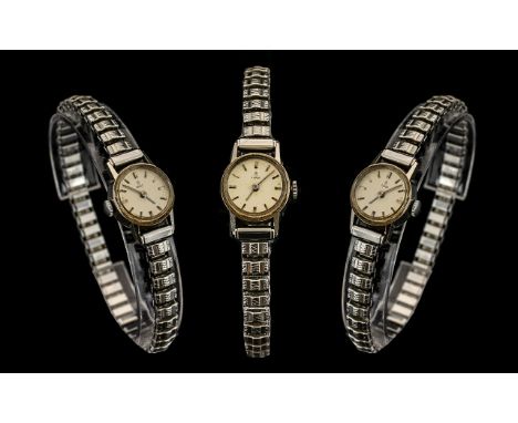 Rolex Tudor Rose Ladies Mechanical Wind Wrist Watch with Attached Stainless Steel Expanding Bracelet. c.1950's. Marked to Bac