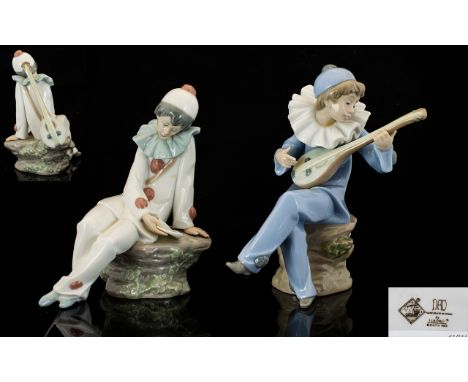 Nao by Lladro Pair of Figures comprising 1. Harlequin strumming a mandolin. Height 7.5 inches 18.75cms. 2. Harlequin with man