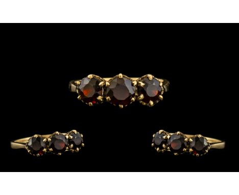 Ladies 9ct Gold 3 Stone Garnet Set Ring. Hallmark for 9ct. Ring Size N. 2.5 grams. 