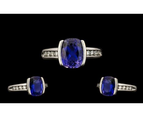 18ct White Gold - Quality Tanzanite and Diamond Set Dress Ring of Pleasing Design. The Tanzanite of Good Grade / Colour with 