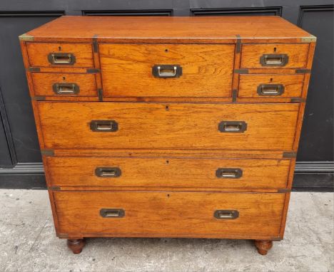 An early 20th century teak and brass bound campaign chest,&nbsp;with inset ivory label inscribed 'Army &amp; Navy C.S.L., Mak