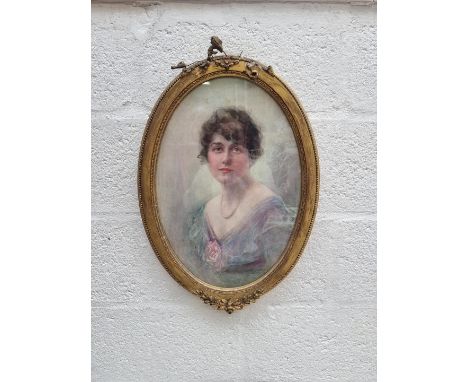 Dorothy M Morgan,&nbsp;head and shoulders portrait of a young lady, signed, watercolour, 48 x 33cm oval. 