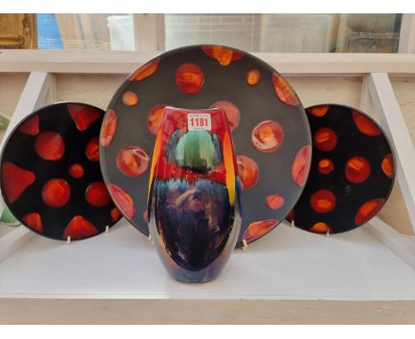 A group of Poole pottery,&nbsp;to include a large charger, 40cm diameter; and a vase, 25.5cm high. (4) 