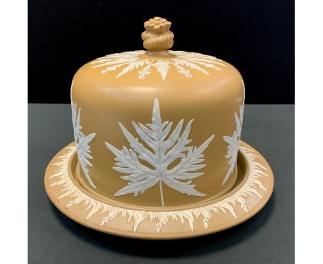 A Victorian stilton cheese dish and cover, applied in white with leaves on a tan ground, 31cm diam, marked BP &amp; Co 