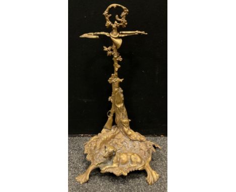 A 20th century brass stick stand, cast with gun dog, shotgun and game, 55cm high 