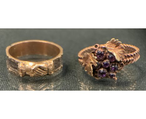 A 19th century mourning ring, clasped hands crest above hairwork channelled shank, unmarked, size H, 1.5g gross;  a garnet gr