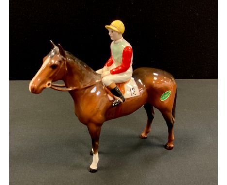 A Beswick Racehorse and Jockey, standing,  brown gloss jockey in light green and light blue silks with red sleeves and yellow