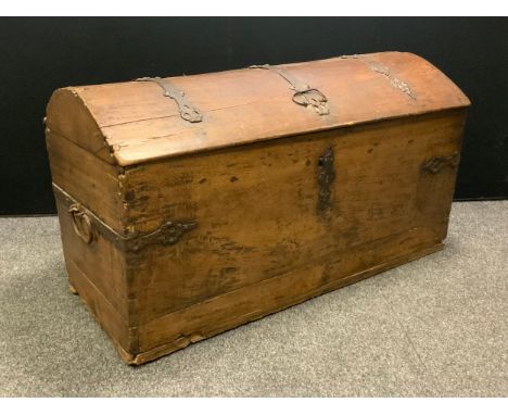 An early 18th century Scandinavian oak domed top trunk, iron straps, the interior with candlebox, 120cm wide, 69cm high, c.17