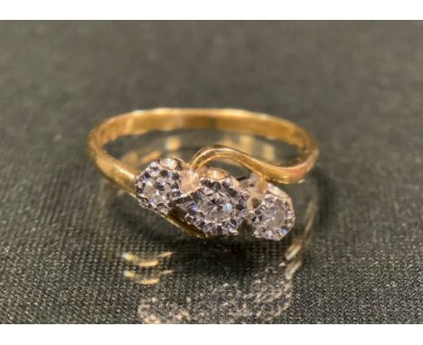 A diamond ring, with three illusion set diamond crest, total estimated diamond weight approx 0.10ct, indistinctly marked gold