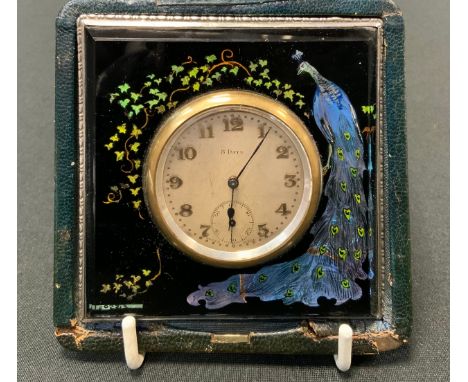 An early 20th century 8 day travel clock, the square case with peacock, silver mount, morocco case, 9cm wide, c.1920 