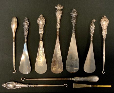 A silver hafted show horn, embossed with scrolls, Chester 1912;  others;  similar button hooks;  etc (10) 