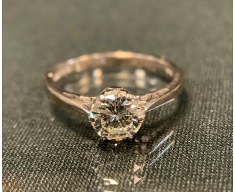 A diamond solitaire ring,  the round brilliant cut diamond approx 1.00ct, 18ct white gold shank, London 1975, size M, 3.4g gr