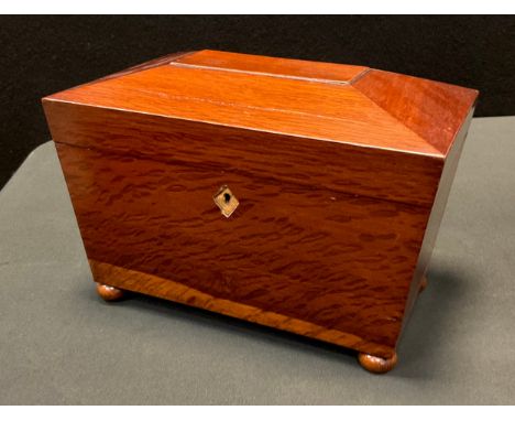 A 19th century walnut  sarcophagus tea caddy, the interior with three compartments, bun feet, 15.5cm high, 25.5cm wide, c.185