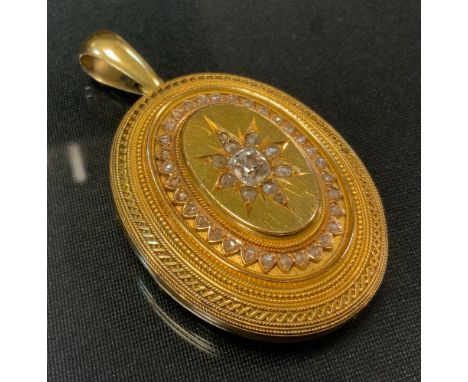 A Victorian diamond set locket, central old cut diamond approx 0.50ct, surround by rose cut accents, total estimated diamond 
