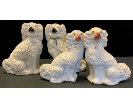 A pair of 19th century Staffordshire Spaniels, modelled seated with chain leads, black detailing, 34cm high, 26.5cm long;  an