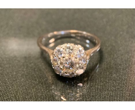 A diamond cluster ring, central old brilliant cut diamond approx 0.50ct surrounded by eight smaller conforming diamonds, tota