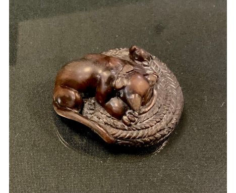 A carved wooden netsuke, as a Cat chasing a Mouse in a Basket, unsigned, 4.7cm long 