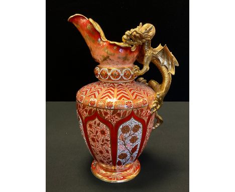 A large Copeland Spode double dragon jug, decorated in iron red,  orange and gilt with stylised floral panels, the handle as 