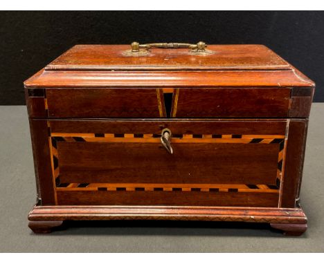 An 18th century mahogany tea caddy, pagoda top, the front and sides inlaid with chequered band, the interior with three metal