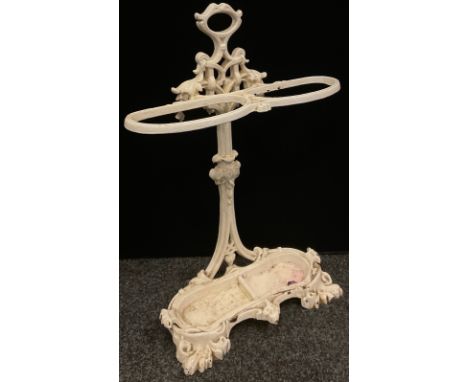 An early 20th century cast iron walking stick/umbrella stand, leafy scrolling framework and borders, shaped removable drip tr