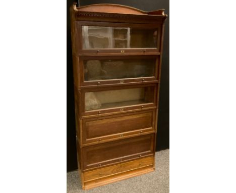 A large Globe Wernicke style Lebus stacking oak six tier bookcase, composed of three glazed  and two panelled sections above 